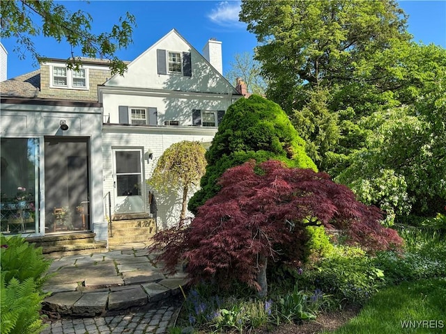 88 Middlesex Rd, Buffalo, NY 14216 - view of front of home with entry steps, a chimney, and a patio