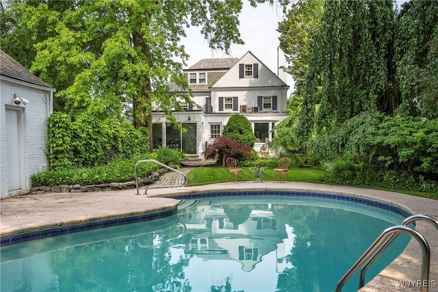 88 Middlesex Rd, Buffalo, NY 14216 - rear view of house with an outdoor pool and stucco siding
