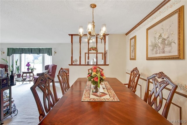 1 Woodstream Dr, Lancaster, NY 14086 - carpeted dining room featuring a chandelier, a textured ceiling, and crown molding