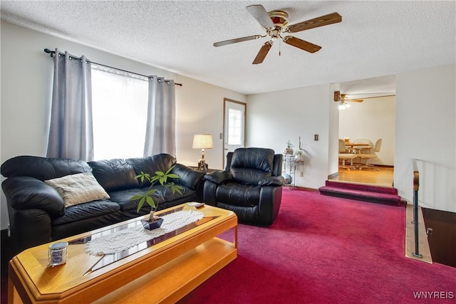 1 Woodstream Dr, Lancaster, NY 14086 - living room featuring ceiling fan, a textured ceiling, and carpet floors