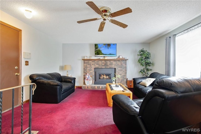1 Woodstream Dr, Lancaster, NY 14086 - carpeted living area with a ceiling fan, a textured ceiling, and a fireplace