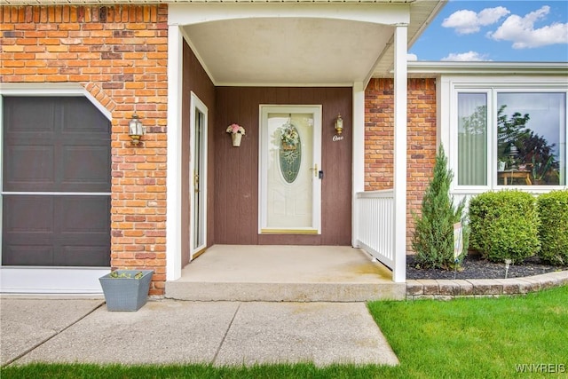 1 Woodstream Dr, Lancaster, NY 14086 - property entrance featuring brick siding and a garage