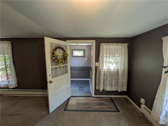 135 Hedgehog Ln, Bradford Town, PA 16701 - carpeted entrance foyer featuring a baseboard heating unit and baseboards