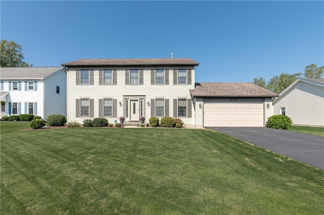 439 Red Apple Ln, Greece, NY 14612 - colonial inspired home featuring driveway, an attached garage, and a front lawn
