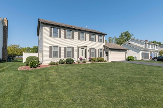 439 Red Apple Ln, Greece, NY 14612 - colonial inspired home featuring a garage, asphalt driveway, and a front yard