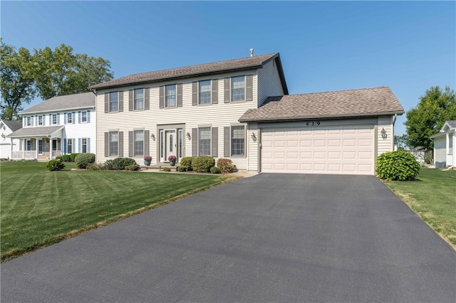 439 Red Apple Ln, Greece, NY 14612 - colonial house with driveway, a garage, and a front lawn