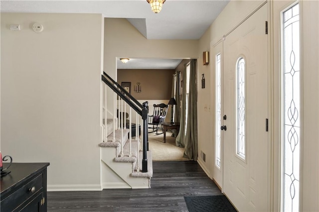 439 Red Apple Ln, Greece, NY 14612 - entrance foyer featuring dark wood-type flooring, baseboards, and stairway