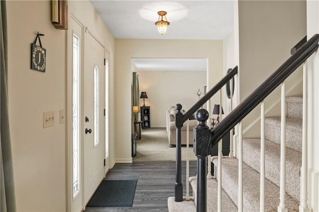 439 Red Apple Ln, Greece, NY 14612 - entrance foyer with stairs, dark wood-style flooring, and baseboards