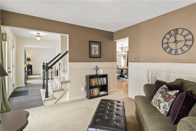 439 Red Apple Ln, Greece, NY 14612 - living room with a chandelier, carpet flooring, and stairway