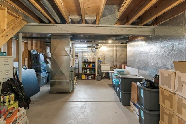 439 Red Apple Ln, Greece, NY 14612 - unfinished below grade area featuring a sink and heating unit