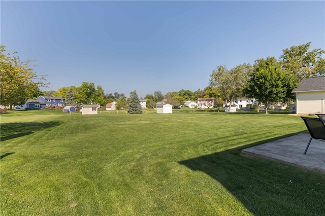 439 Red Apple Ln, Greece, NY 14612 - view of grassy yard featuring a patio