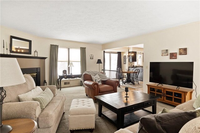 439 Red Apple Ln, Greece, NY 14612 - living area featuring a chandelier, light colored carpet, and ornamental molding