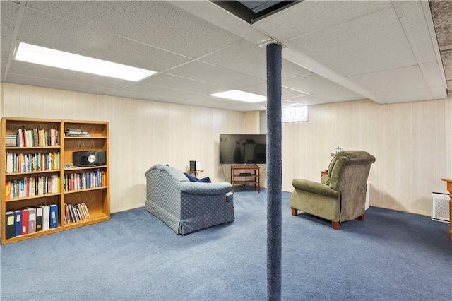 439 Red Apple Ln, Greece, NY 14612 - living area with a paneled ceiling, carpet flooring, and wood walls