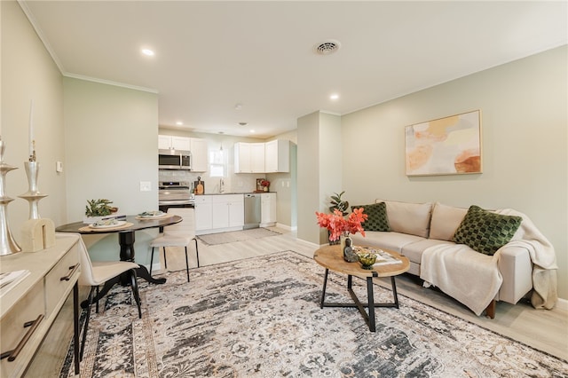 237 Heberle Rd, Irondequoit, NY 14609 - living room with crown molding, recessed lighting, baseboards, and light wood-type flooring