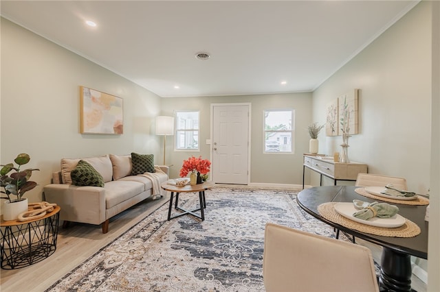 237 Heberle Rd, Irondequoit, NY 14609 - living room with light wood finished floors, crown molding, and recessed lighting