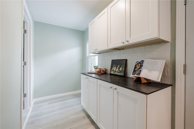 237 Heberle Rd, Irondequoit, NY 14609 - bar area featuring light wood-style floors, baseboards, and backsplash