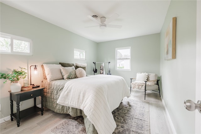 237 Heberle Rd, Irondequoit, NY 14609 - bedroom with light wood-style flooring, baseboards, and ceiling fan