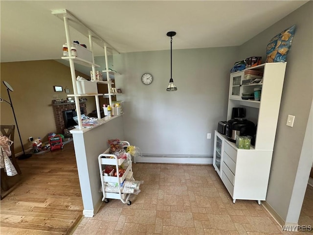 57 Brookdale Dr, Amherst, NY 14221 - dining room featuring a fireplace and a baseboard heating unit