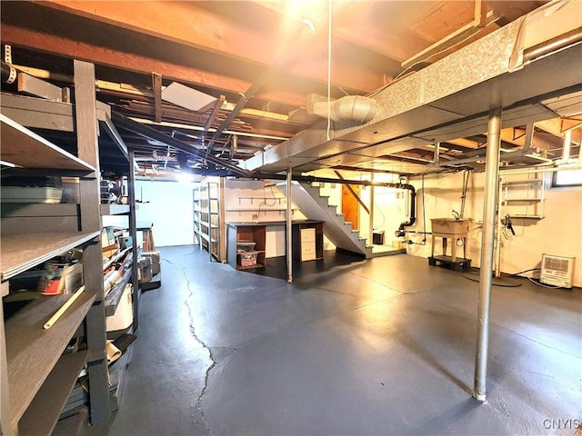 70 W Elizabeth St, Skaneateles, NY 13152 - unfinished below grade area featuring stairway and a workshop area