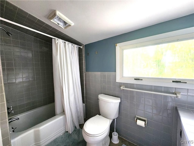 70 W Elizabeth St, Skaneateles, NY 13152 - bathroom featuring tile walls and shower / tub combo