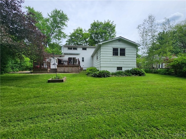 70 W Elizabeth St, Skaneateles, NY 13152 - back of property with a wooden deck and a yard