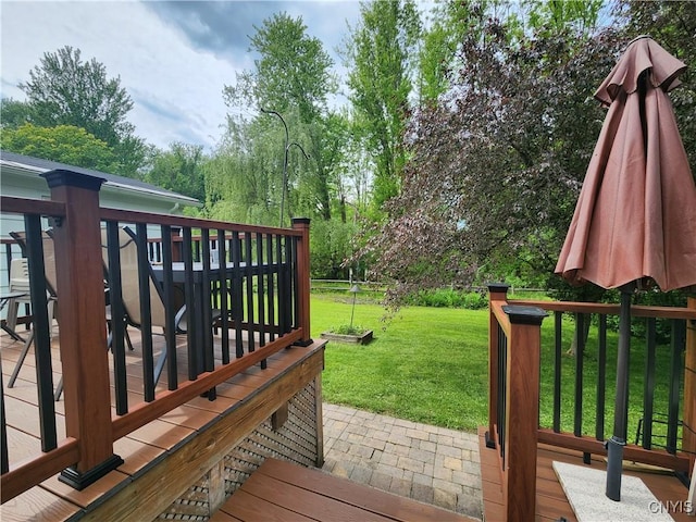 70 W Elizabeth St, Skaneateles, NY 13152 - wooden deck featuring a lawn