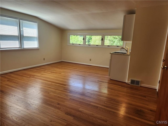70 W Elizabeth St, Skaneateles, NY 13152 - spare room with vaulted ceiling and hardwood / wood-style flooring