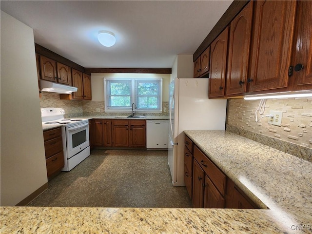 70 W Elizabeth St, Skaneateles, NY 13152 - kitchen with white appliances, under cabinet range hood, and tasteful backsplash