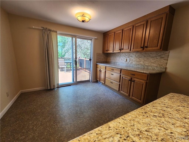 70 W Elizabeth St, Skaneateles, NY 13152 - kitchen featuring tasteful backsplash and brown cabinets