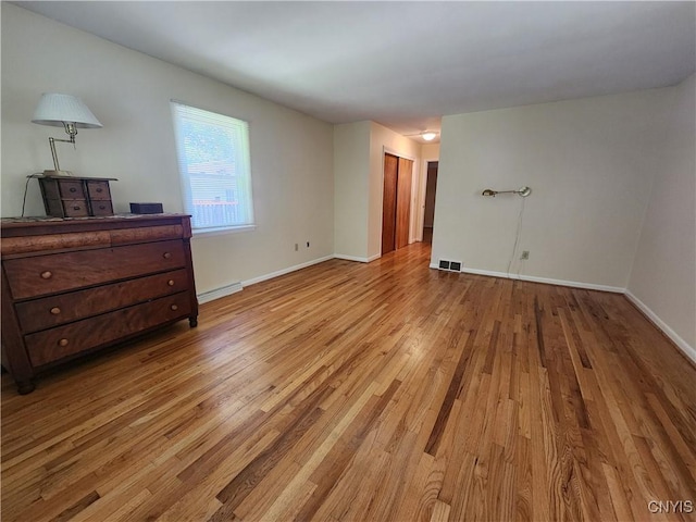 70 W Elizabeth St, Skaneateles, NY 13152 - unfurnished room featuring wood finished floors and baseboards