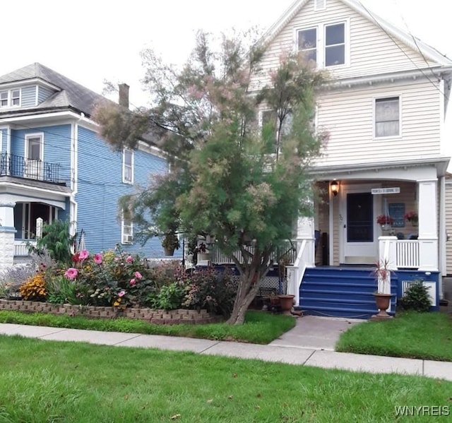 50 Gualbert Ave, Cheektowaga, NY 14211 - traditional style home featuring a porch and a front lawn