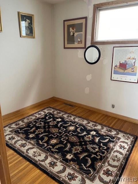 50 Gualbert Ave, Cheektowaga, NY 14211 - spare room featuring wood finished floors and baseboards