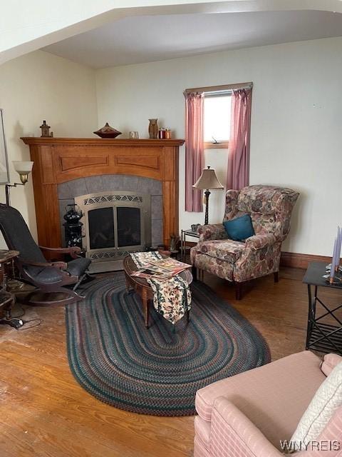 50 Gualbert Ave, Cheektowaga, NY 14211 - living area featuring wood finished floors, a tile fireplace, and baseboards
