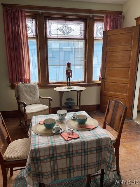 50 Gualbert Ave, Cheektowaga, NY 14211 - dining space with healthy amount of natural light, baseboards, and light wood-type flooring