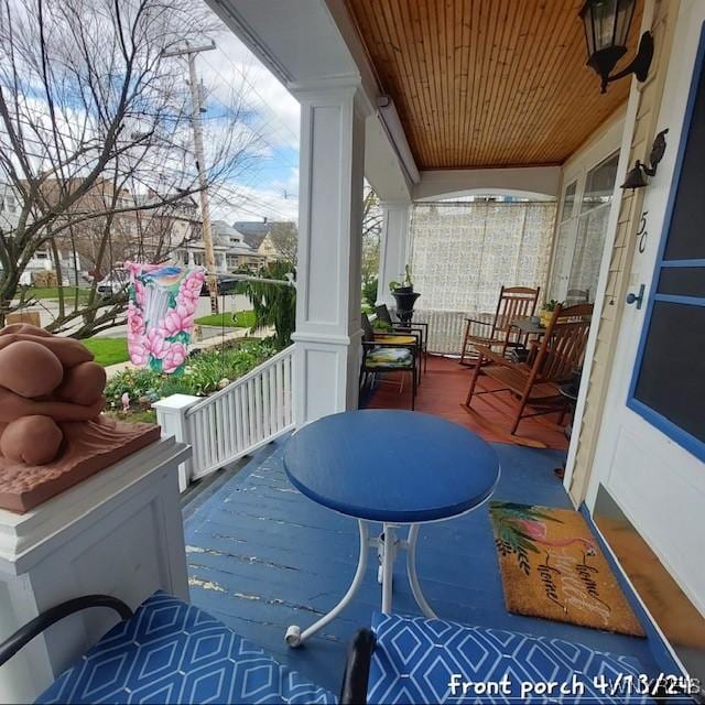 50 Gualbert Ave, Cheektowaga, NY 14211 - sunroom / solarium featuring wood ceiling, decorative columns, and wood finished floors
