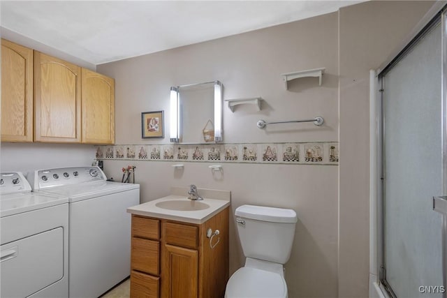 8278 Maple Rd, Clay, NY 13041 - bathroom featuring washer and clothes dryer, a stall shower, vanity, and toilet