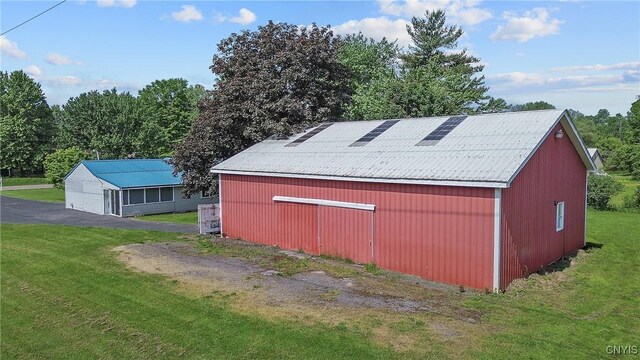 8278 Maple Rd, Clay, NY 13041 - view of pole building with a yard
