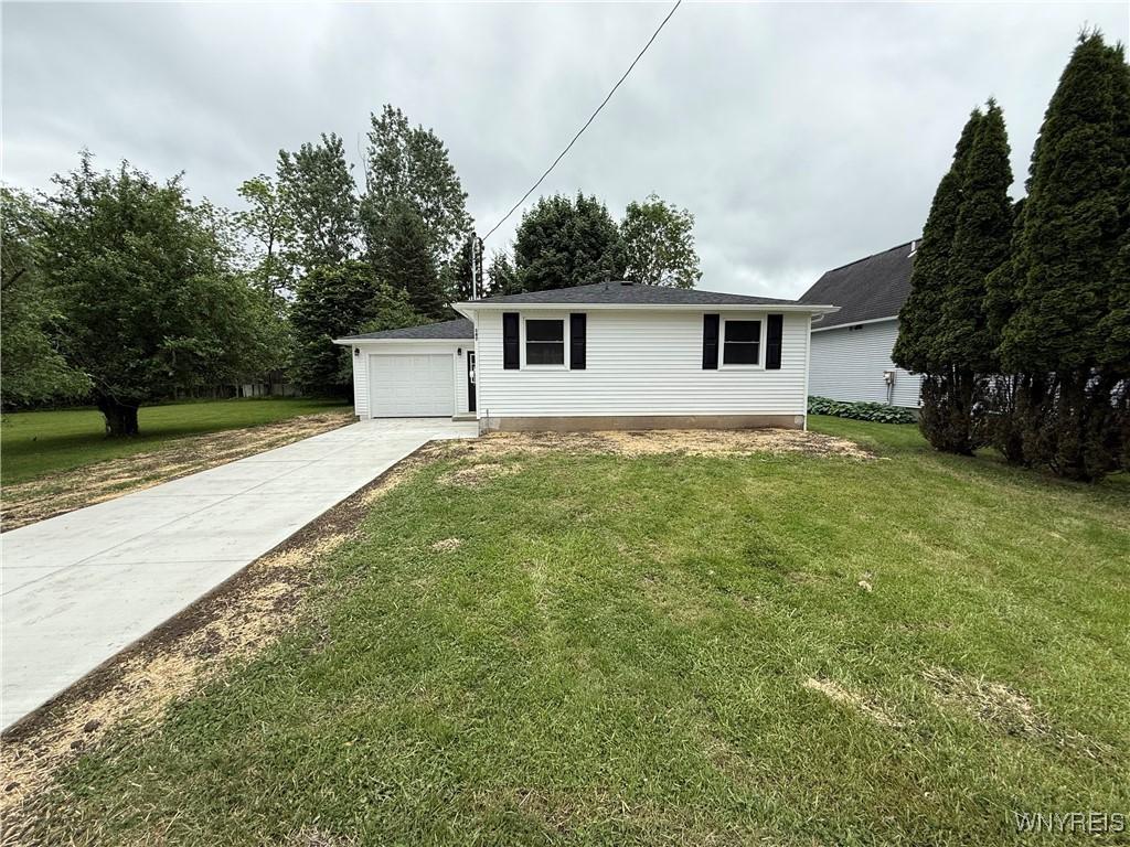 167 Iroquois Ave, Lancaster, NY 14086 - single story home with a front yard and a garage