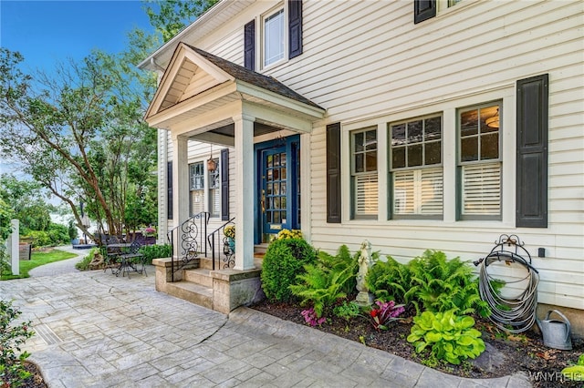 8431 W Rivershore Dr, Niagara Falls, NY 14304 - view of exterior entry featuring a patio area
