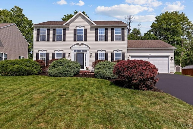 163 Golden Meadows Way, Camillus, NY 13164 - colonial home with a garage, asphalt driveway, and a front lawn