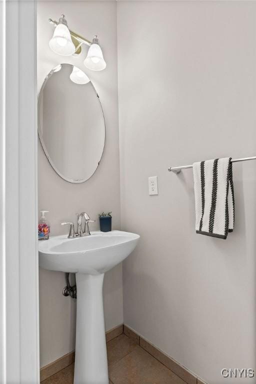 163 Golden Meadows Way, Camillus, NY 13164 - bathroom with baseboards, tile patterned flooring, and a sink