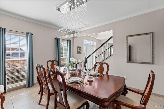 163 Golden Meadows Way, Camillus, NY 13164 - dining room featuring light tile patterned floors, ornamental molding, plenty of natural light, and baseboards