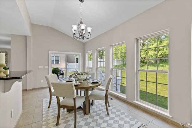 163 Golden Meadows Way, Camillus, NY 13164 - dining room featuring light tile patterned flooring, a chandelier, vaulted ceiling, and baseboards