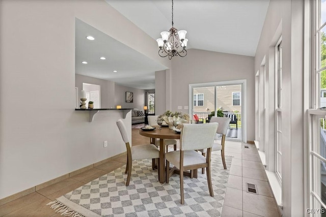 163 Golden Meadows Way, Camillus, NY 13164 - dining space with light tile patterned floors, vaulted ceiling, a chandelier, and recessed lighting