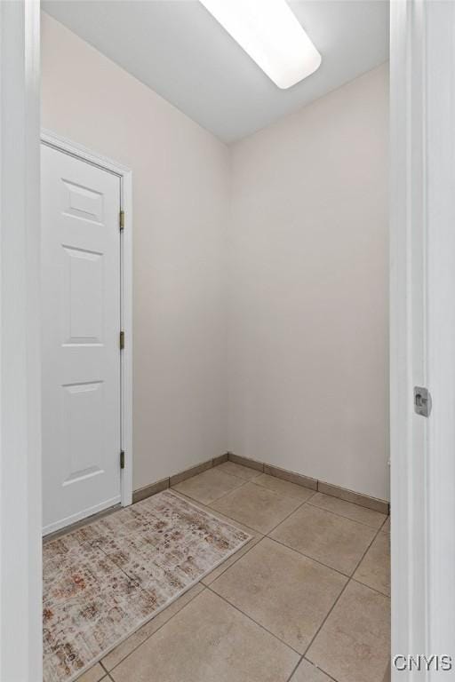 163 Golden Meadows Way, Camillus, NY 13164 - spare room featuring light tile patterned floors and baseboards