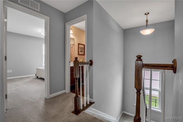 123 Stonebridge Rd, Grand Island, NY 14072 - hallway with an upstairs landing, baseboards, and carpet flooring