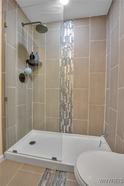 123 Stonebridge Rd, Grand Island, NY 14072 - bathroom featuring tiled shower and toilet