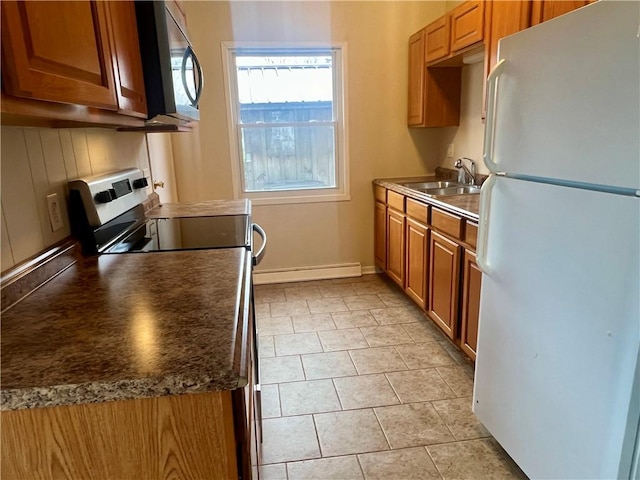 137 Matthew Cir, Horseheads, NY 14845 - kitchen featuring freestanding refrigerator, baseboard heating, stainless steel range with electric cooktop, a sink, and brown cabinetry