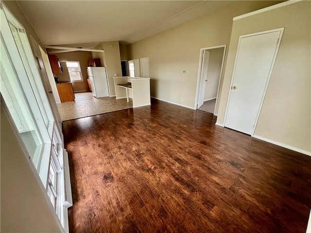 137 Matthew Cir, Horseheads, NY 14845 - unfurnished living room with dark wood finished floors, baseboards, and vaulted ceiling