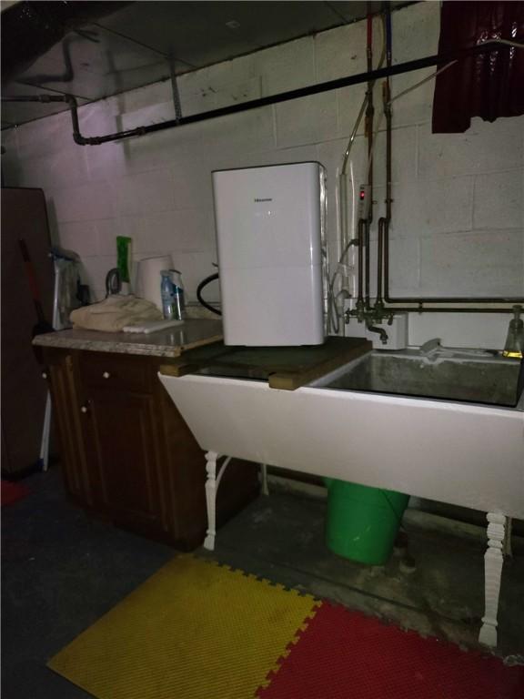 313 Gardner Rd, Horseheads, NY 14845 - laundry room featuring concrete block wall